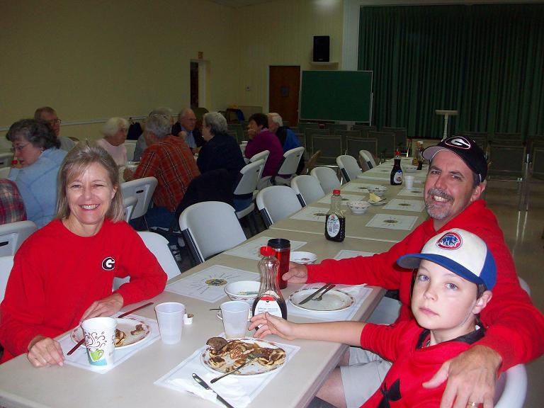 A family enjoying pancakes